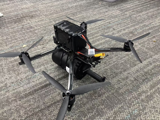 कैमरा के साथ FPV फाइबर क्वाडकॉप्टर ड्रोन 15km 0.28mm उच्च तन्यता 60-70N